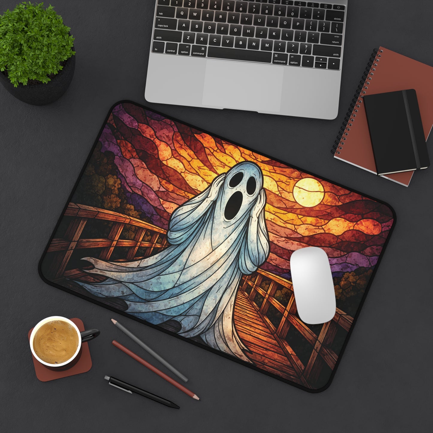 Halloween ghost desk mat with blue ghost, sunset stained-glass bridge, warm moonlit glow
