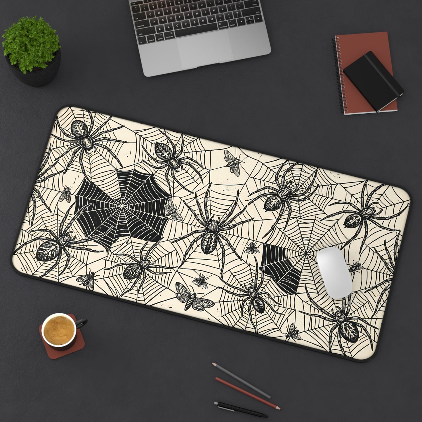 Spider web desk mat with vintage spider and web design, rounded corners, black trim