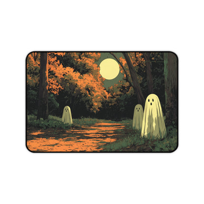 Rectangular desk mat showing orange path, autumn trees, smiling ghost figures, bright moon