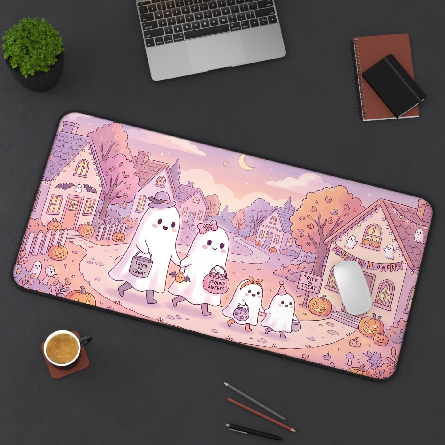 Kawaii Halloween desk mat with ghost family, pumpkin details, pink scene and rounded shape