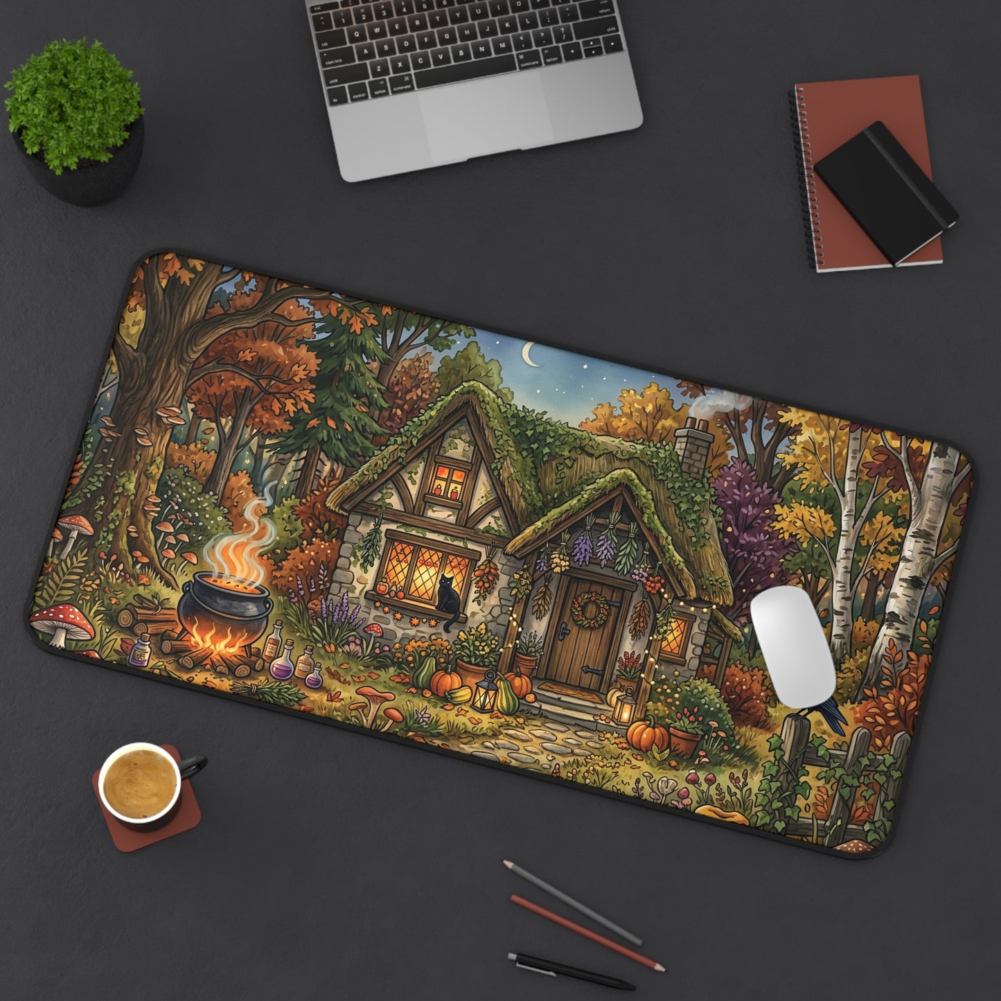 Rectangular desk mat with rounded edges, autumn cottage garden, trees, flowers, and bird silhouette