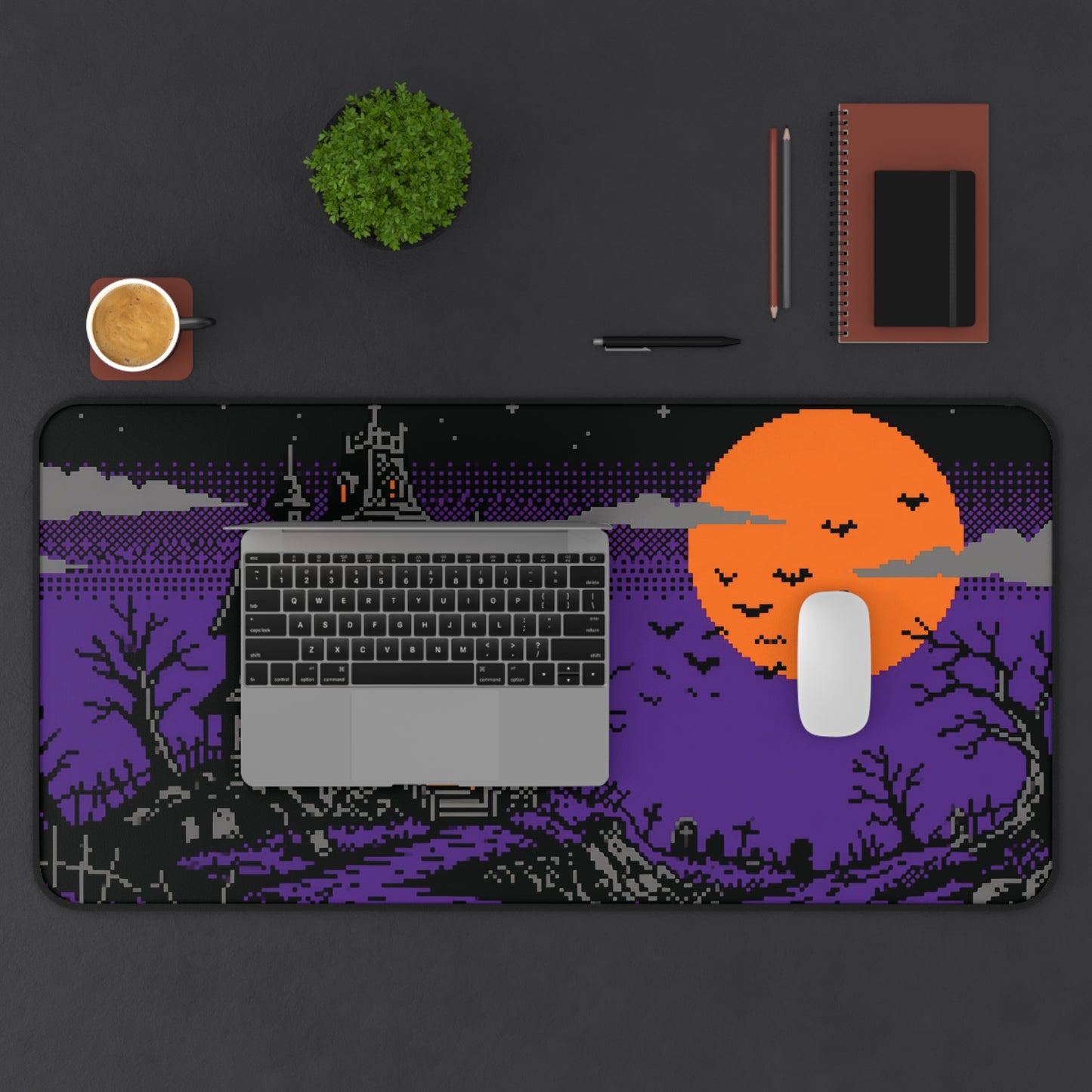 Pixel art haunted house desk mat with orange moon and keyboard area design