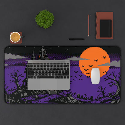 Pixel art haunted house desk mat with orange moon and keyboard area design