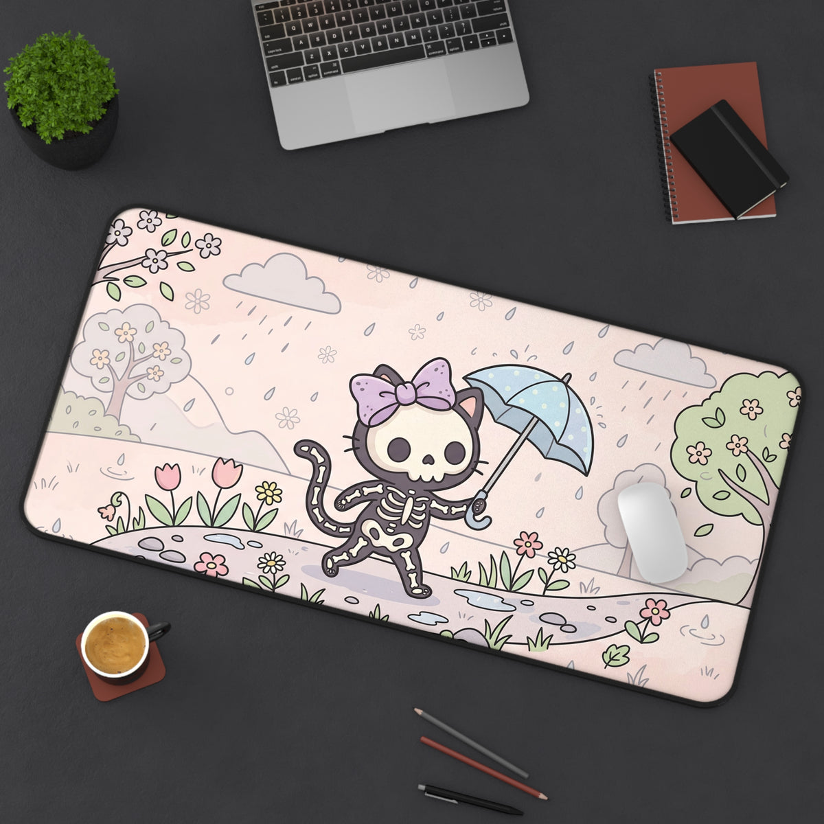 Skeleton cat desk mat with umbrella and flowers, visible rounded corners and black trim edge