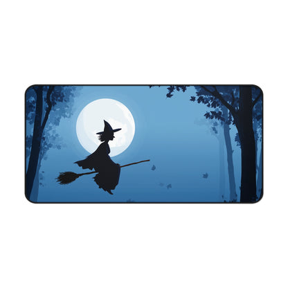 Long blue desk mat with flying witch silhouette and moon graphic, rounded corners