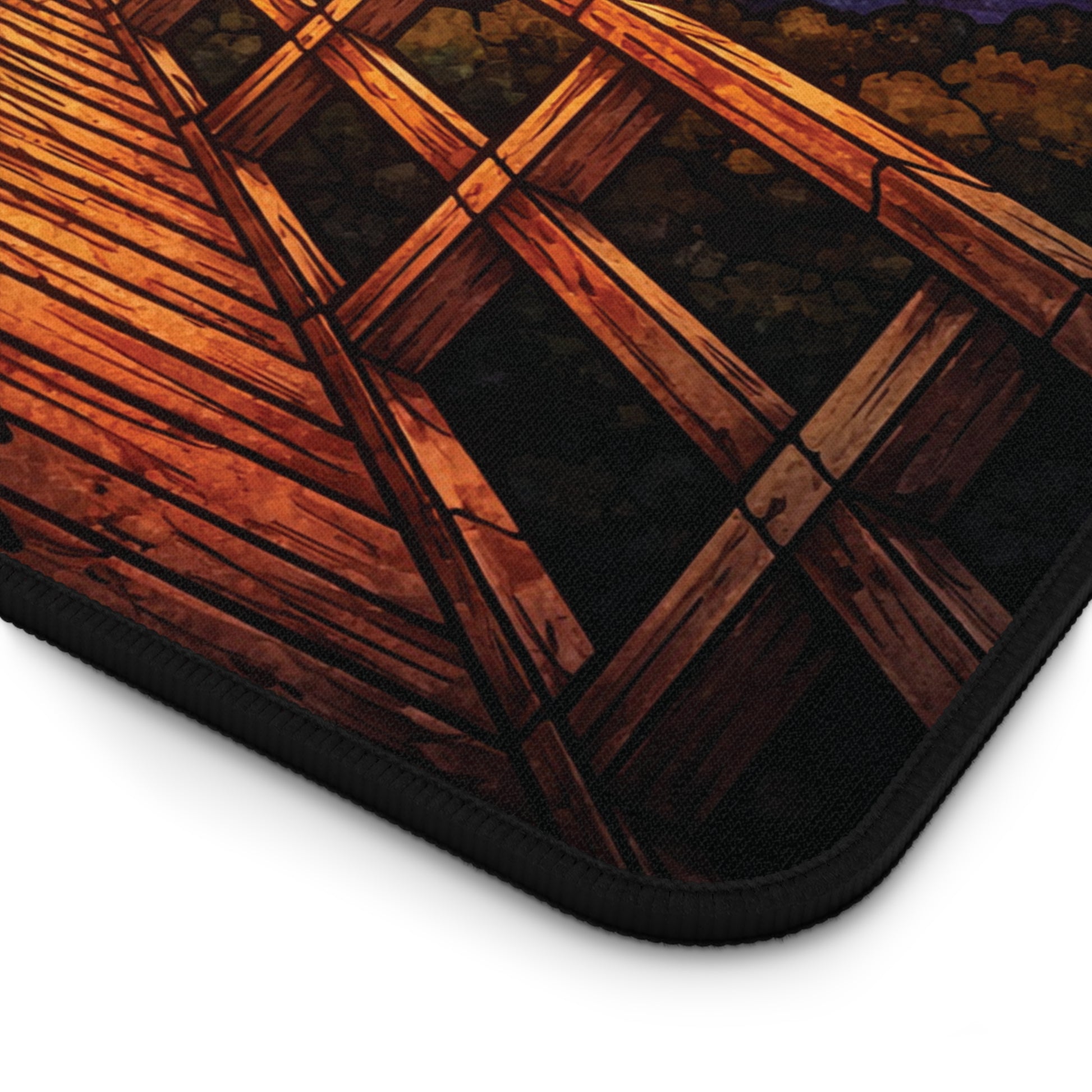 Stained-glass desk mat corner with stitched edge and wood-bridge pattern