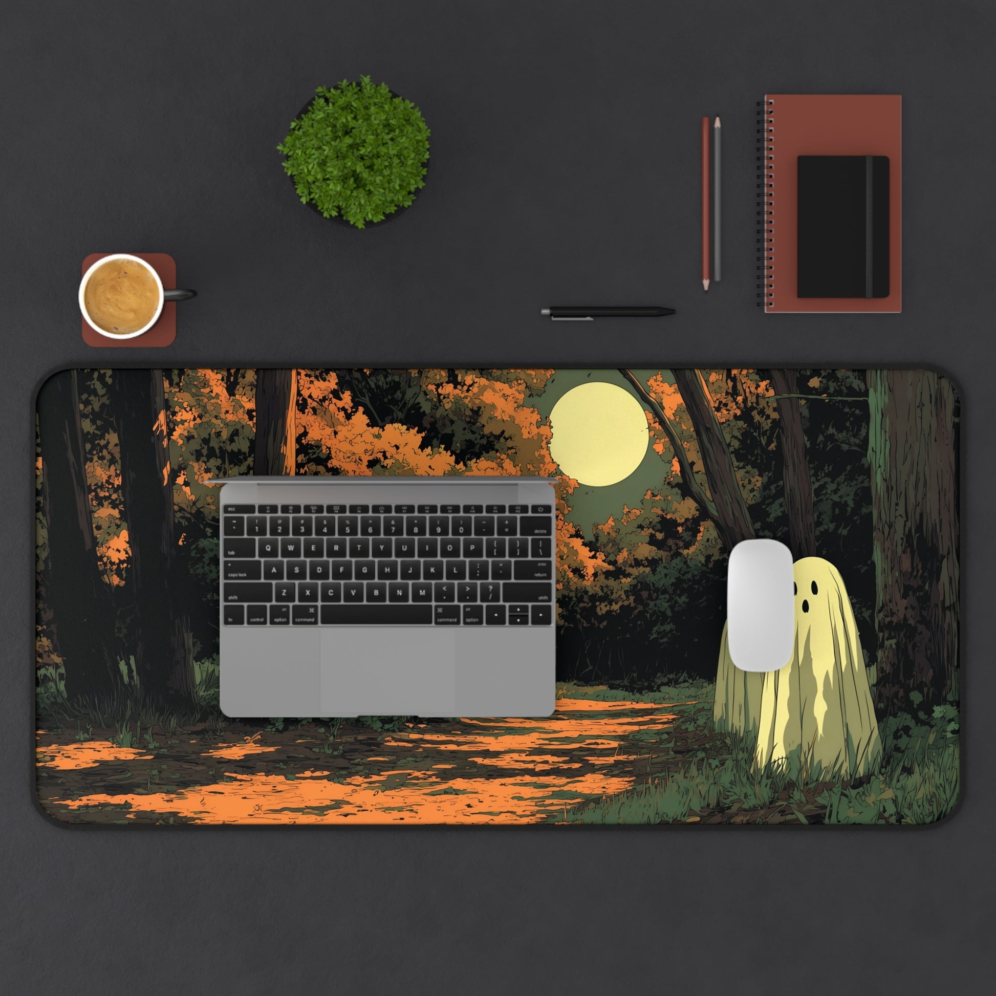 Rectangular desk mat with orange forest path, moonlight, and three friendly ghost figures