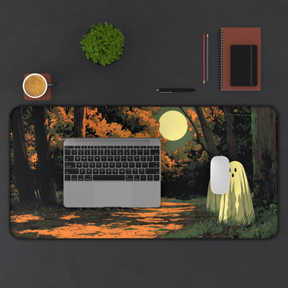 Rectangular desk mat with orange forest path, moonlight, and three friendly ghost figures
