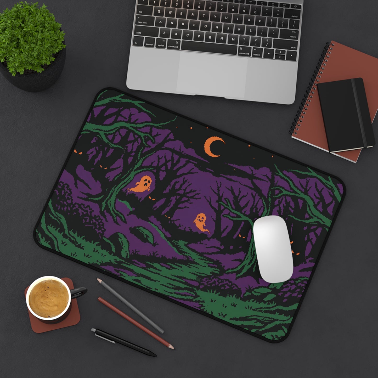 Halloween forest desk mat with purple-and-green woodland graphic, glowing orange eyes, moon