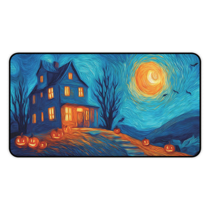 A rectangular desk mat with rounded corners featuring a stylized, Van Gogh-inspired Halloween scene. The artwork depicts a dark haunted house with glowing orange windows, jack-o'-lantern pumpkins on the lawn, bare trees, and a swirling blue night sky with a bright orange moon.