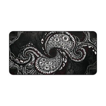 Black desk mat with white tentacle eye illustration, rounded corners and stitched border