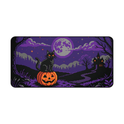 Rectangular desk mat with pixel art black cat, purple moon, and jack-o-lantern scene