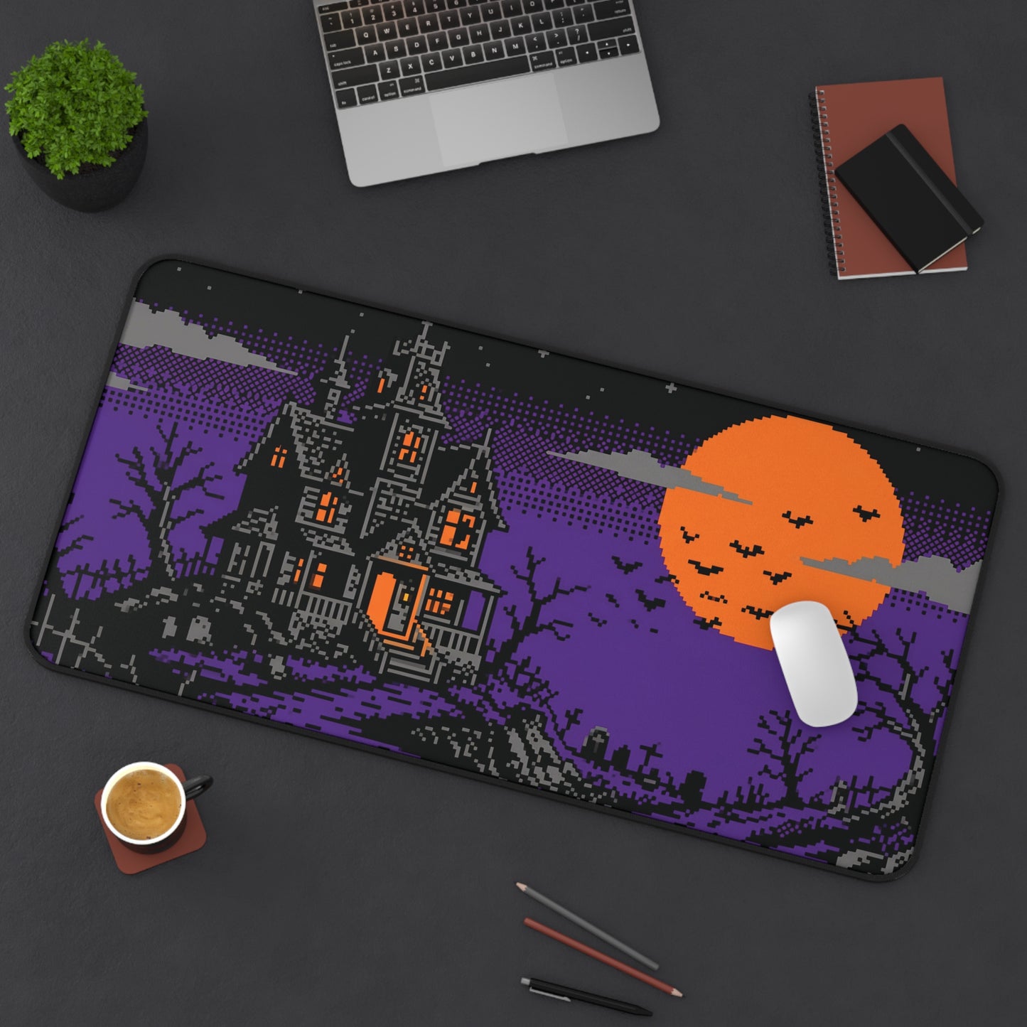 Purple retro gaming desk mat featuring pixel haunted house and orange moon