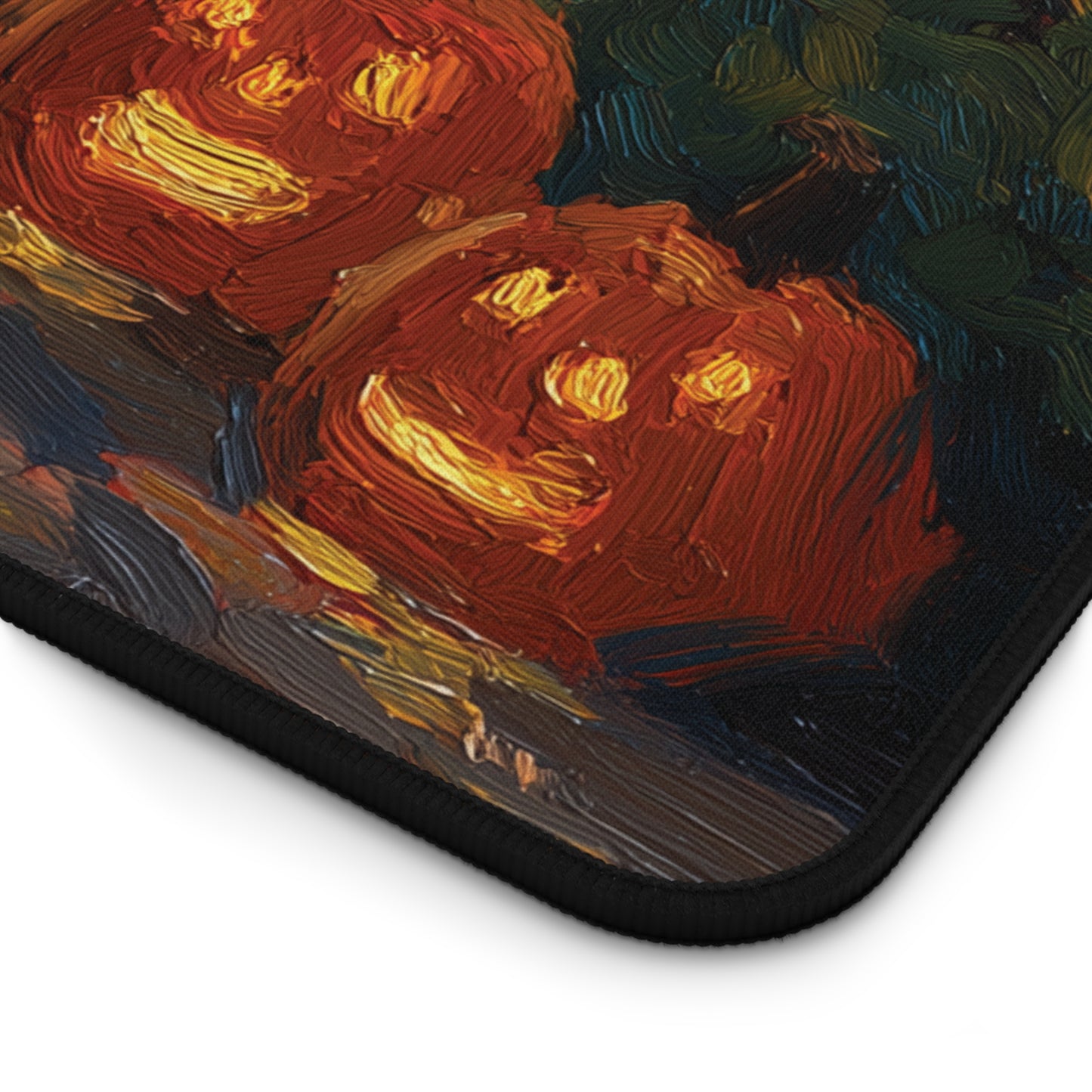 A close-up of a printed mouse pad or desk mat showing a painted scene of carved pumpkins with glowing yellow faces on a dark background. The product has a black stitched border and is photographed on a white background.