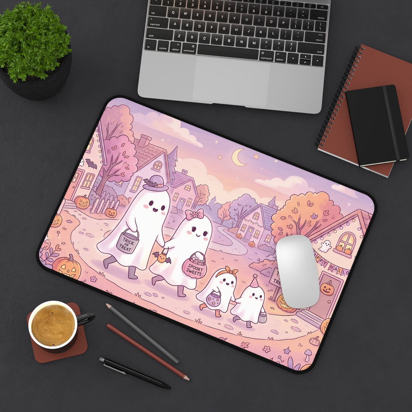 Halloween desk mat with kawaii ghost family illustration, pink spooky houses and rounded edge