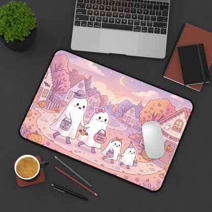 Halloween desk mat with kawaii ghost family illustration, pink spooky houses and rounded edge