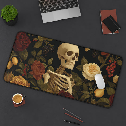 Rectangular desk mat with skeleton skull, roses, and leaves botanical print, angled view