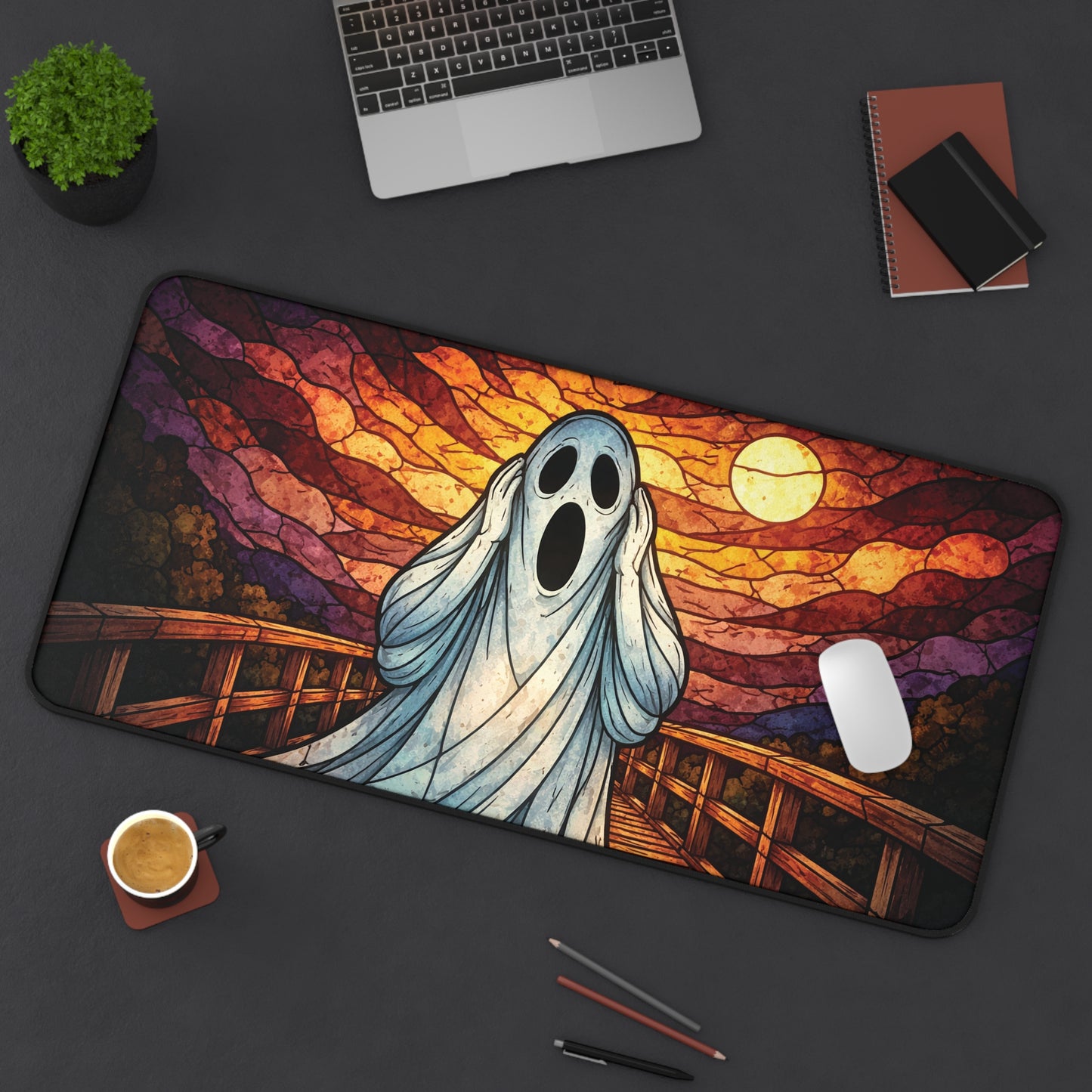 Halloween ghost desk mat with blue ghost and sunset stained-glass bridge artwork, curved corners