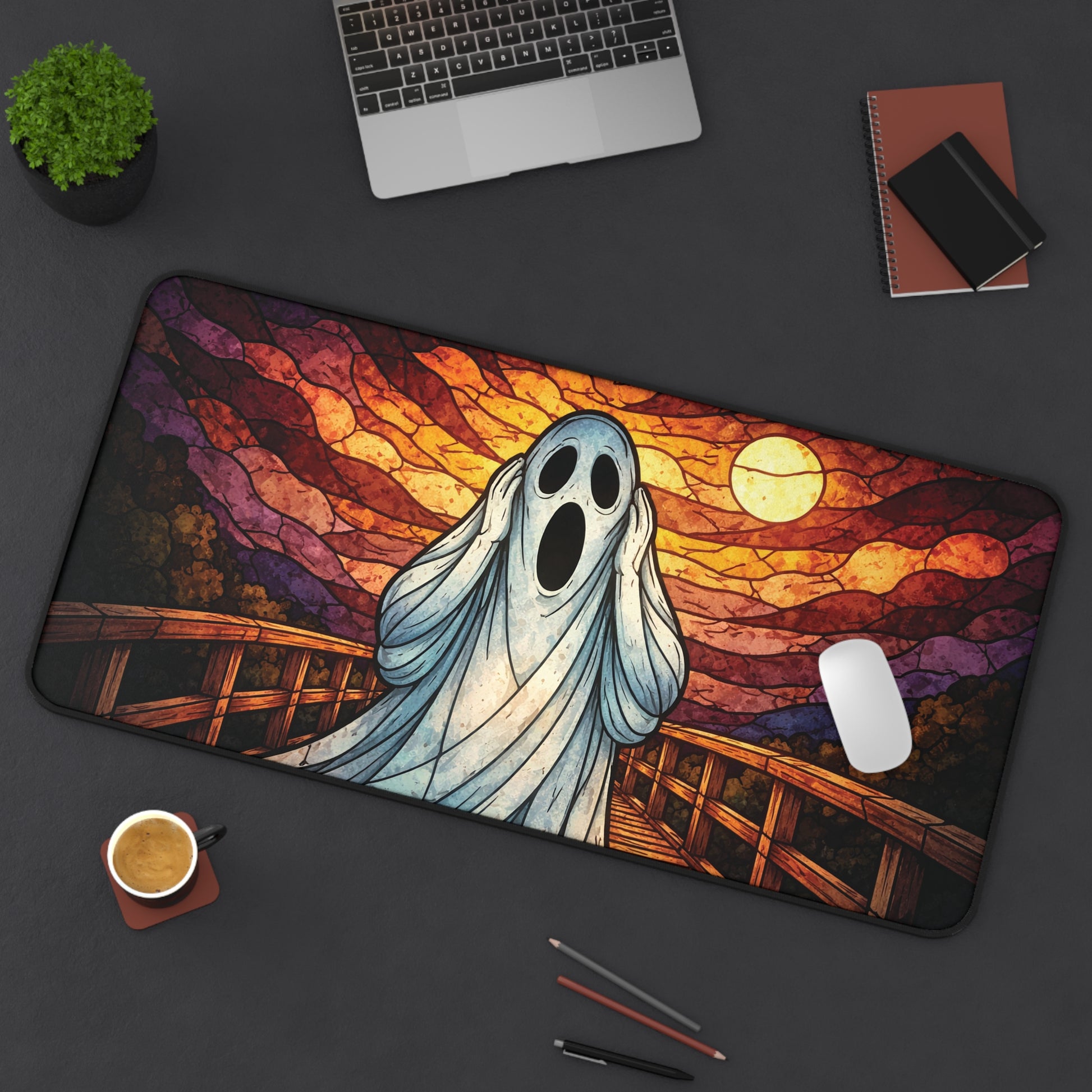 Halloween ghost desk mat with blue ghost and sunset stained-glass bridge artwork, curved corners