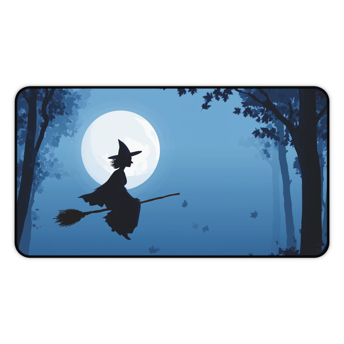 Blue desk mat with flying witch silhouette, moon backdrop, and dark tree silhouettes