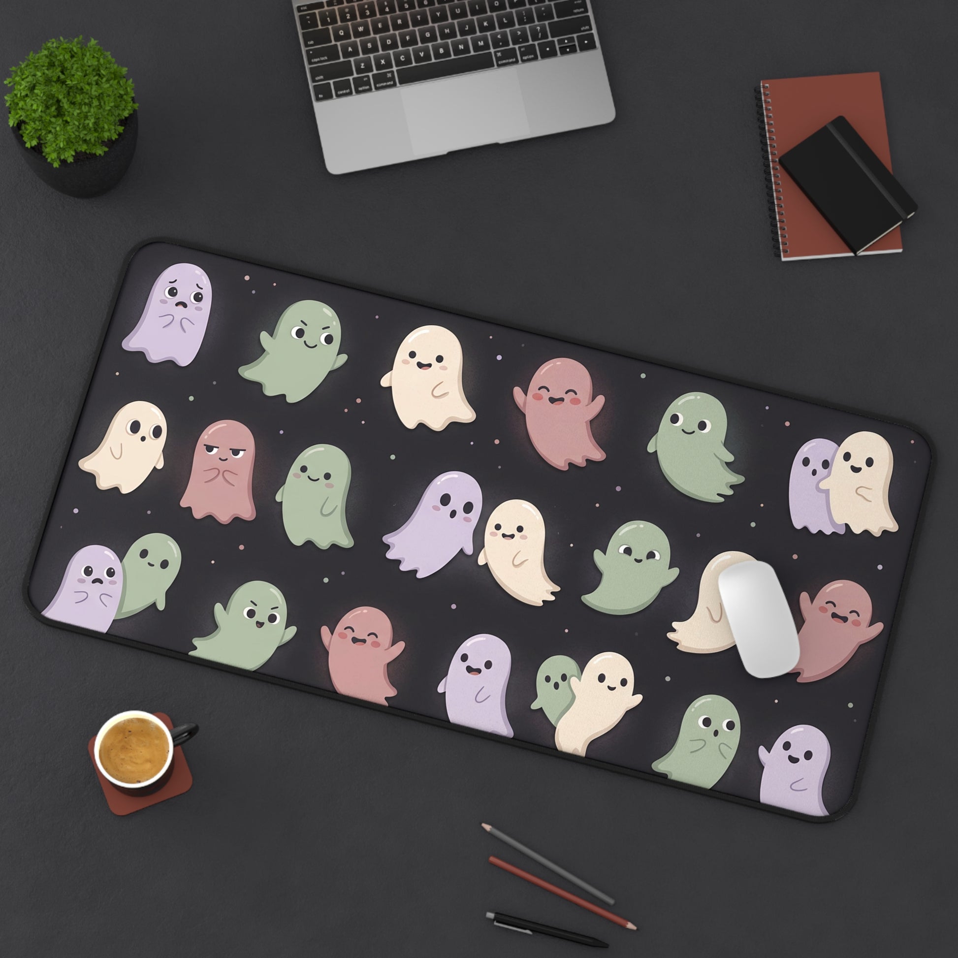 Pastel ghost repeat desk mat with dark background and stitched edge border