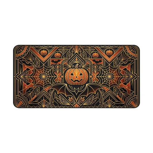 Halloween desk mat with art deco pumpkin, spiderweb, and leaf pattern in gold on black