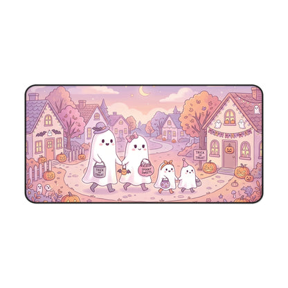 Cute Halloween desk mat with kawaii ghost family, pink town scene, rounded corners