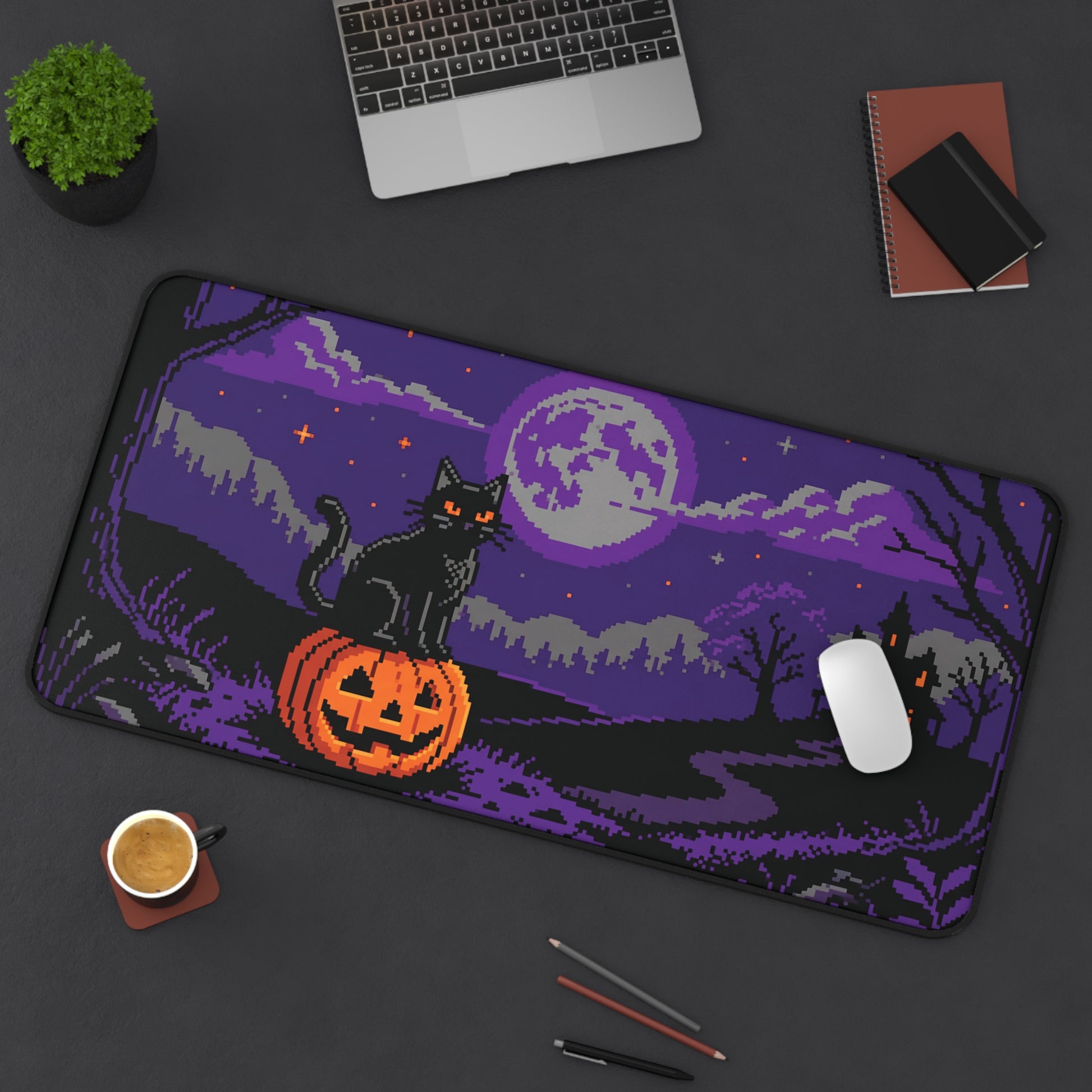 Rectangular desk mat with pixel art black cat, orange jack-o-lantern, and purple moon