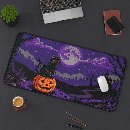Rectangular desk mat with pixel art black cat, orange jack-o-lantern, and purple moon