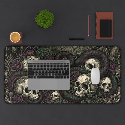 Gothic botanical desk mat featuring skulls, coiled snake, roses, and lizard accents