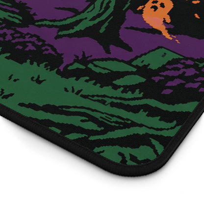 Corner of Halloween forest desk mat with black stitched border on purple-green graphic