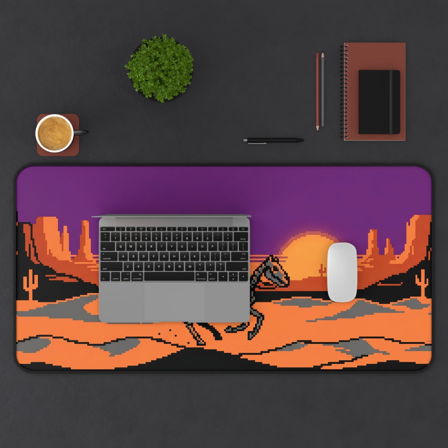 Pixel art cowboy desk mat featuring a western desert sunset pixel scene with purple frame