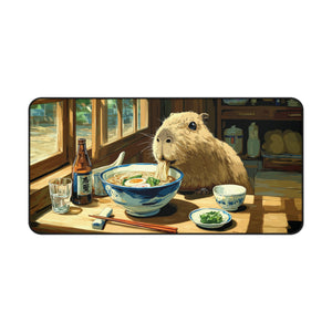 Rectangular desk mat with capybara eating ramen illustration, rounded black border