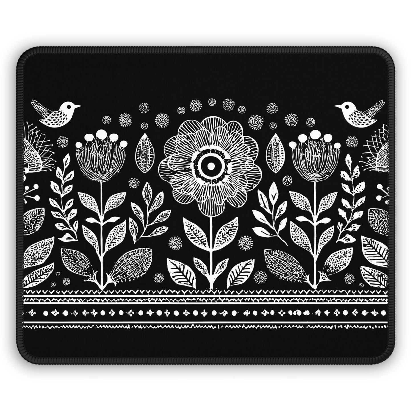 A rectangular black mouse pad with rounded corners, featuring a white hand-drawn style botanical pattern of flowers, leaves, birds, and decorative borders.